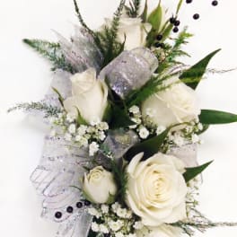 White rose bouquet with silver ribbon and small white filler flowers