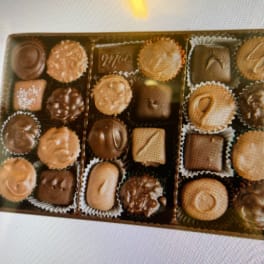 Assorted chocolates arranged in a rectangular gift box
