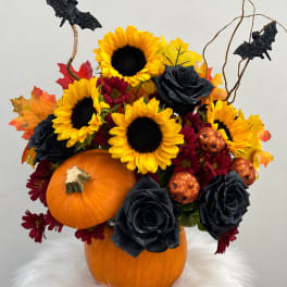 Halloween bouquet with sunflowers, black roses, and pumpkins