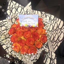 Bouquet of orange-red roses with baby's breath and a get well card