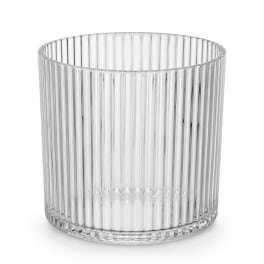 Clear ribbed glass vase on a white background