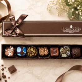 Box of assorted chocolates with a ribbon bow