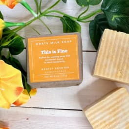 Goat milk soap bars with yellow-orange flowers and green leaves