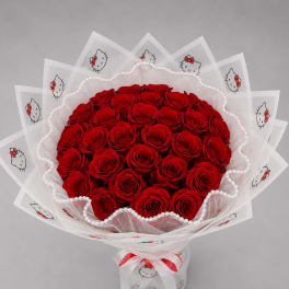 Bouquet of red roses wrapped in Hello Kitty printed paper with a white ribbon