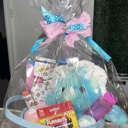 Gift basket with plush toys and crayons wrapped in clear plastic