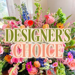 Colorful mixed flower arrangement with large text reading "DESIGNER'S CHOICE"