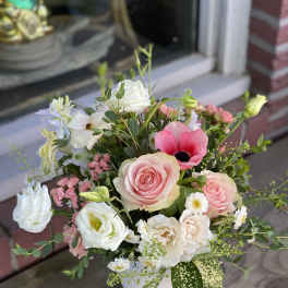 Pink and white mixed bouquet in a white vase