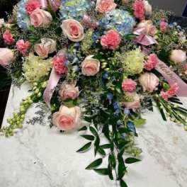 Large pastel floral spray with pink roses and blue hydrangeas