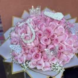 Bouquet of pink roses with silver decorative accents