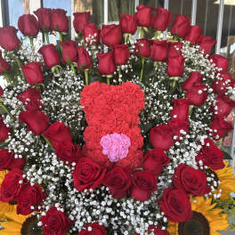 Large bouquet of red roses with baby’s breath and sunflowers