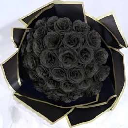 Bouquet of black roses wrapped in black paper with gold trim