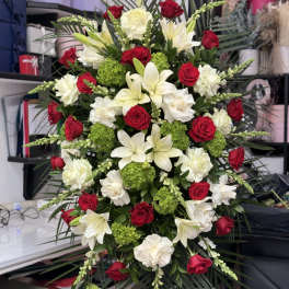 Large red and white floral spray with lilies and roses