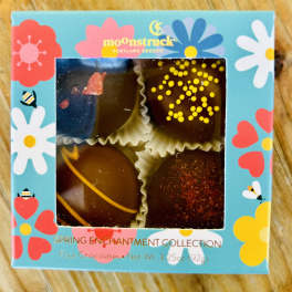 Box of four decorated chocolates in a floral spring-themed package