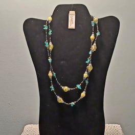 Beaded double-strand necklace on a black display bust