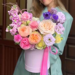 Pastel bouquet in a lavender hatbox with a pink ribbon