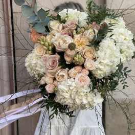 Large bouquet of blush roses and white hydrangeas with eucalyptus