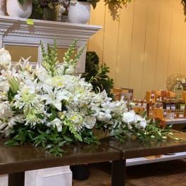 Large white floral arrangement on a table