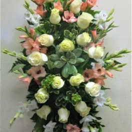 Tall floral spray with white roses and peach lilies