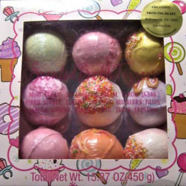 Box of colorful frosted cake pops in a candy-themed package
