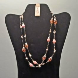 Beaded necklace displayed on a black bust stand