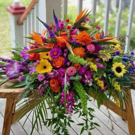 Bright mixed bouquet with orange, pink, purple, and yellow flowers