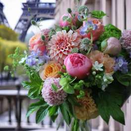 Pastel bouquet of roses, peonies, and dahlias with greenery