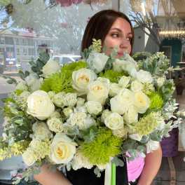 Large bouquet of white roses and green chrysanthemums with eucalyptus