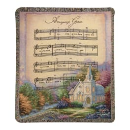 Decorative throw blanket with a church and sheet music design