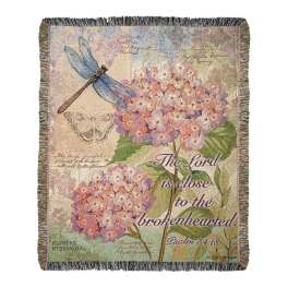Decorative throw blanket with hydrangeas, dragonflies, and a Bible verse