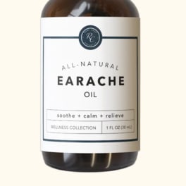 Amber dropper bottle labeled earache oil