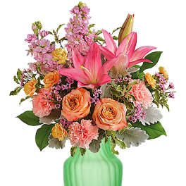 Pink lilies and peach roses in a green vase