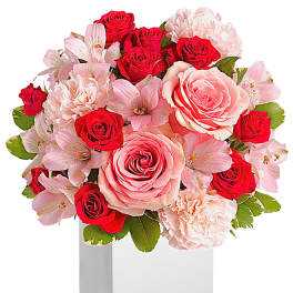 Pink and red rose bouquet in a white box vase