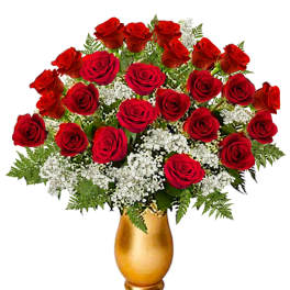 Red roses and white filler flowers in a gold vase