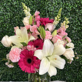 Pink and white mixed bouquet in a clear glass vase