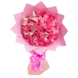 Pink rose bouquet wrapped in pink paper with a satin bow