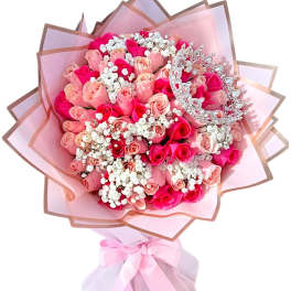 Pink rose bouquet with a silver tiara and pastel wrapping