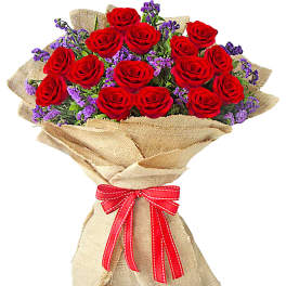 Bouquet of red roses with purple filler wrapped in burlap and tied with a red ribbon