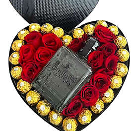 Heart-shaped gift box with red roses and gold chocolates