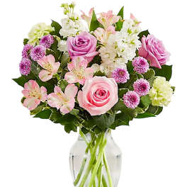 Pink and white mixed bouquet in a clear glass vase