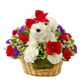Teddy bear made of white flowers in a basket with red roses and a red bow
