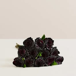 Bouquet of dark red roses with green leaves