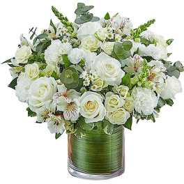 White rose and alstroemeria arrangement in a glass vase