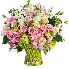 Pink and white roses with alstroemeria in a glass vase