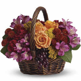 Basket of mixed flowers with roses and alstroemeria