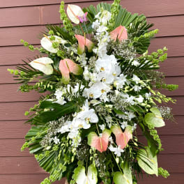 Large standing floral spray with white orchids and pink anthuriums