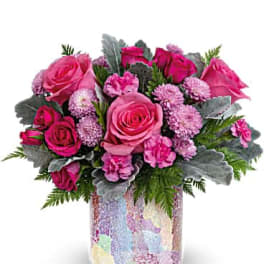 Pink roses and carnations in a mosaic glass vase
