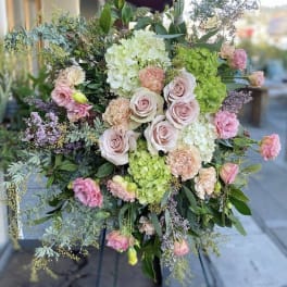 Large pastel bouquet with roses, hydrangeas, and carnations