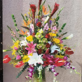 Colorful mixed flower arrangement in a glass vase