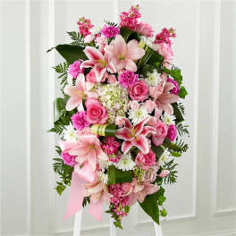 Pink and white floral standing spray with lilies and roses