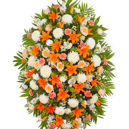 Standing floral spray with orange lilies, white mums, and pale roses